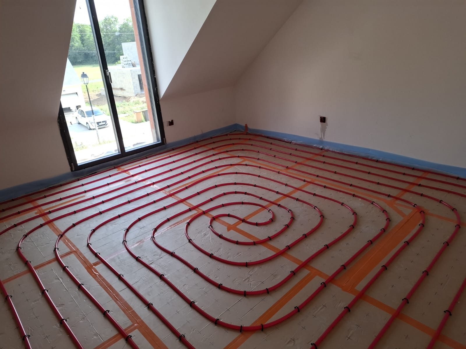 Plancher chauffant chambre mansardée — pose en escargot